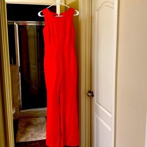 Jumpsuit color red brand Bebe size XS wear only once like new